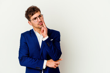 Young business caucasian man isolated on white background looking sideways with doubtful and skeptical expression.