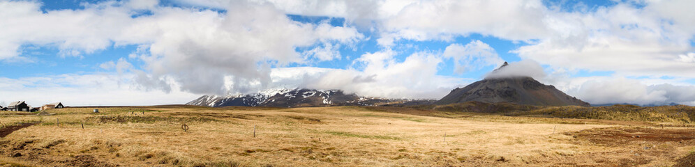 Fototapeta na wymiar Panoramic view of mountainous Hellnar during a sunny summer day, Snaefellsnes National Park in Iceland