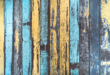 The vintage color wood background. The texture of the retro wood grain table. Decorated and colorful old wood wall. Blue painted vintage weathered wooden planks closeup. Abstract wooden background.
