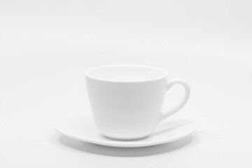 Empty white coffee cup with saucer Isolated on white background with copy space for text