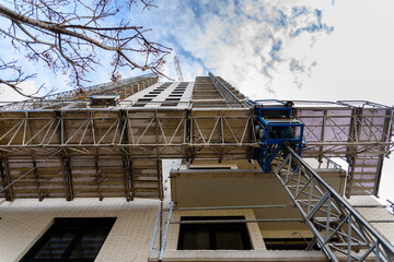 Modern mechanized scaffold for building repairs.
