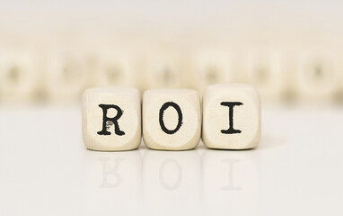 Word ROI made with wood building blocks