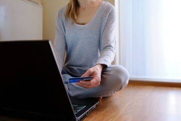 Concept of doing shopping without leaving your house. Woman shopping on-line