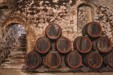 Champagne caves and barrels with champagne and pupitres in Hautvillers near Reims and Epernay.