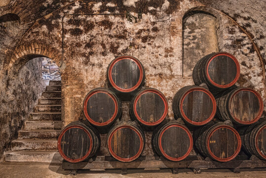 Champagne caves and barrels with champagne and pupitres in Hautvillers near Reims and Epernay.