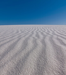 Fototapeta na wymiar White sand dunes showing wind ripples in formations of gypsum hills at national monument park in southwest north america mexico natural area.