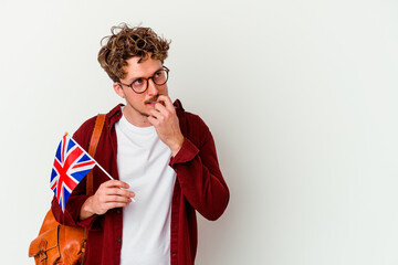 Young student man learning english isolated on white background relaxed thinking about something looking at a copy space.