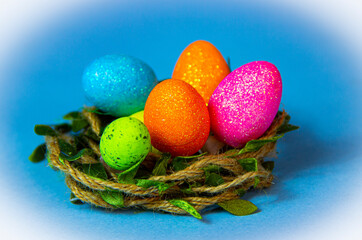 Easter eggs in nest , blue Easter background