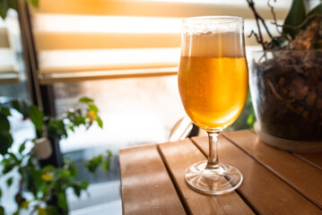 A delicious glass of home brewed craft beer on a table