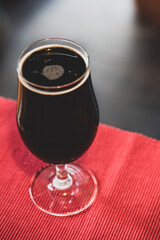 A delicious glass of home brewed craft beer on a table