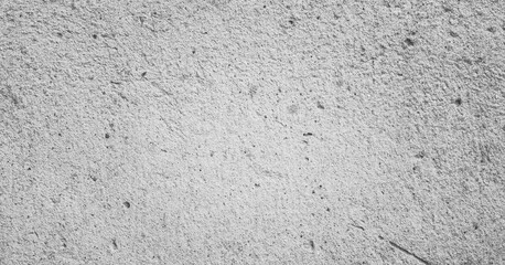 Grungy wall background with cracks, stones and paint. 