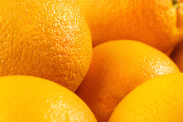 Obraz na płótnie Canvas ripe oranges in a wicker basket, natural background