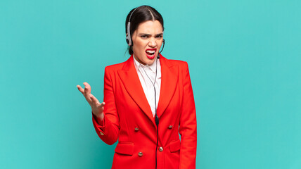 young pretty woman looking angry, annoyed and frustrated screaming wtf or what’s wrong with you....