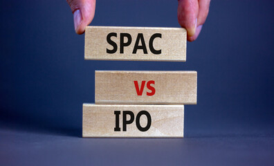 SPAC vs IPO symbol. Blocks with words 'SPAC, special purpose acquisition company' and 'IPO, initial...