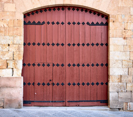 Wooden door in a stone travel house of the time
medieval
