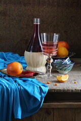 Still life with red wine and citrus
