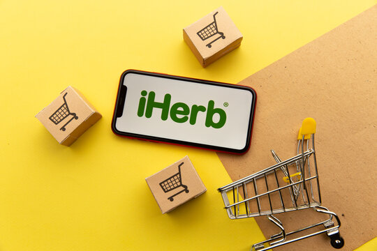 Tula, Russia - January 26, 2021: iHerb logo on iPhone display