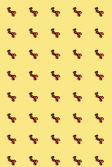 Vertical pattern with several roasted coffee beans on a light background. Coffee template.