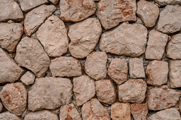 Marble bricks stone wall close-up . marble bricks texture of the walls. marble pattern of the brick wall. stone fence.