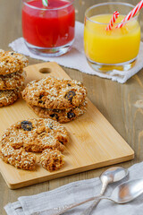 oatmeal cookies with raisins and sesame with orange juice