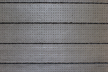 Gray styrofoam. Insulation. Dark background. Grey background.
