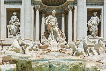Naklejka premium A close up of the sculptures at the front of the Trevi Fountain in Rome, Italy