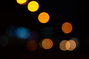 Bright round lights on black background