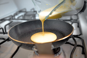 Placing hot cake mix in the pan