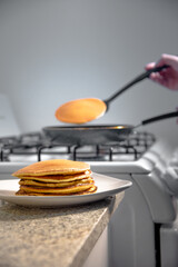 Taking the hotcakes out of the warm skillet