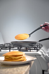 Taking the hotcakes out of the warm skillet