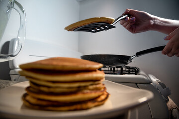 Woman cooking some delicious Hotcake