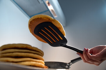 Bottom view of hotcake coming out of the pan