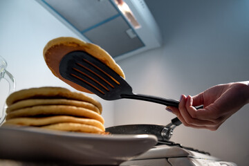 Bottom view of hotcake coming out of the pan