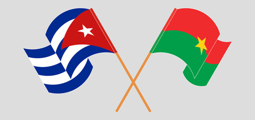 Crossed and waving flags of Cuba and Burkina Faso