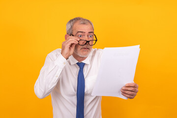 businessman looking surprised at documents isolated - Powered by Adobe