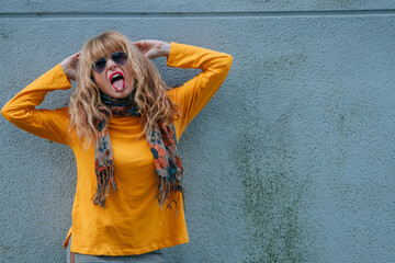 woman with rebellious expression and sunglasses