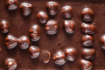 Chocolate background with nuts.Sweet food photo concept.Delicious dessert. Popular sweets.