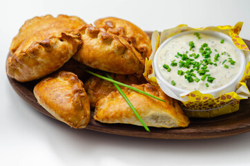 Mini pasties with sour cream, succulent pork, turkey, bacon and cranberry all wrapped in shortcrust pastry