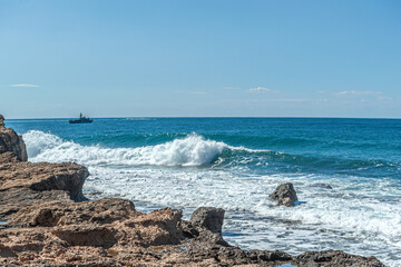  landscape of rocky seashore in clear windy weather
