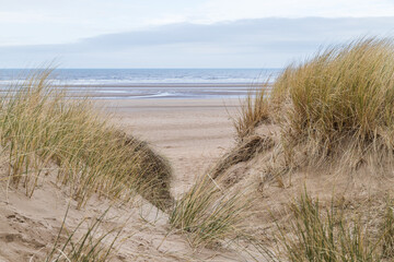 Fototapeta na wymiar Irish Sea between the sand dunes