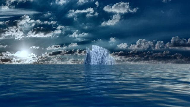 Iceberg in calm water. Sunshine through the clouds