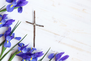 Iris flowers with wood cross, Easter on white background  © Kara