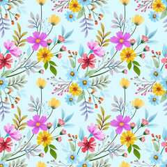 Colorful small flowers and leaves on a light blue color seamless pattern for fabric textile background and backdrop.