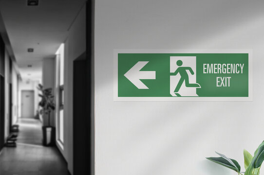 Emergency exit sign hangs on the wall.
Emergency signal useful in case of fire.