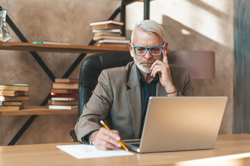 Solution to the problem. A provincial businessman is concentrating on writing an idea on paper....