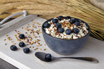 Whole grain oatmeal with blueberry curd and flax seeds