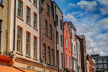 Fototapeta na wymiar Street front facades of apartment buildings in Dublin Ireland