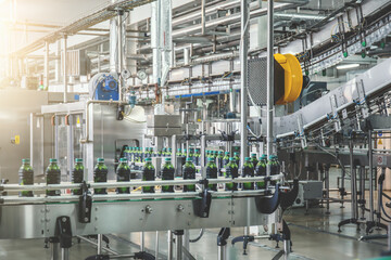 Conveyor belt with juice in bottles, Beverage factory, production line process.