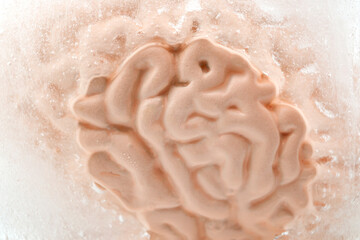 Headache, painful brain freeze and losing mental function concept with close up on human brain...