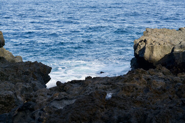 Ocean spray at a raw cliff